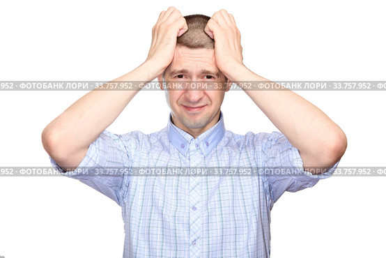 repentant man in a classic blue shirt, short haircut; Grabbed his head with both hands in regret of what had been done; fullface. Isolated. Стоковое фото, фотограф Владимир Арсентьев / Фотобанк Лори