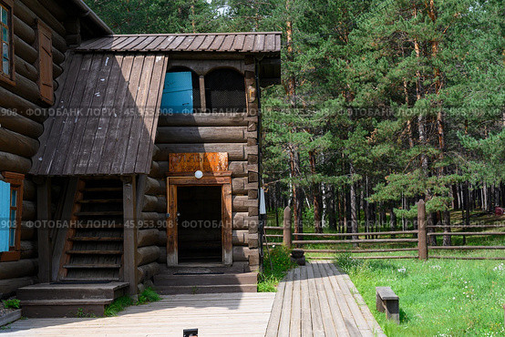 Restored 19th century wooden merchant's manor with lawn and wooden house in Ulan-Ude, Russia. The inscription 'Borisov's Shop' (2024 год). Стоковое фото, фотограф Сергей Фролов / Фотобанк Лори