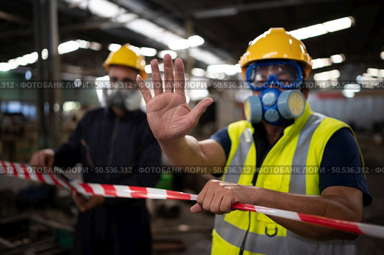 Restricted area, officials employ white and red stripes to block the area where a chemical leak is occurring. To prevent individuals from coming into contact with potentially dangerous chemicals, Стоковое фото, агентство Ingram Publishing / Фотобанк Лори