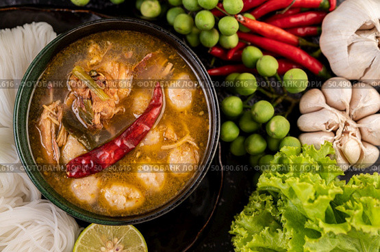 Rice noodles and coconut milk mixed with chilies, bitter melon, lentils, lemons, garlic and eggplant. Стоковое фото, агентство Ingram Publishing / Фотобанк Лори