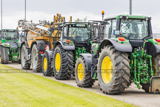 Row of Heavy Duty Agricultural Tractors. Kaunas, Lithuania, 19 June 2025. Редакционное фото, фотограф Zydrius Tartenis / Фотобанк Лори