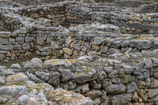 Ruins of stone buildings in the ancient city. Archaeological site. Ruins of the ancient city of Chersonesus. Historical sights of the Crimean peninsula. Sevastopol, Crimea. Редакционное фото, фотограф Андрей Степанов / Фотобанк Лори