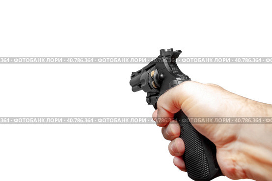 Рука с черным заряженным револьвером. Изолированно на белом фоне. A man 's hand with a black charged revolver is aiming ahead. An isolate on a white background. Стоковое фото, фотограф Валерий Елистратов / Фотобанк Лори