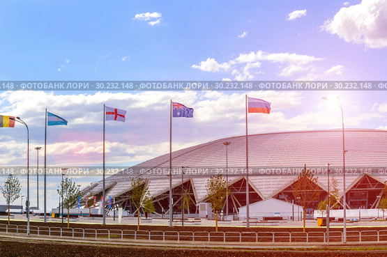 Russia, Samara, June 2018: national flags, countries participating in the World Cup, against the backdrop of the stadium. Редакционное фото, фотограф Акиньшин Владимир / Фотобанк Лори