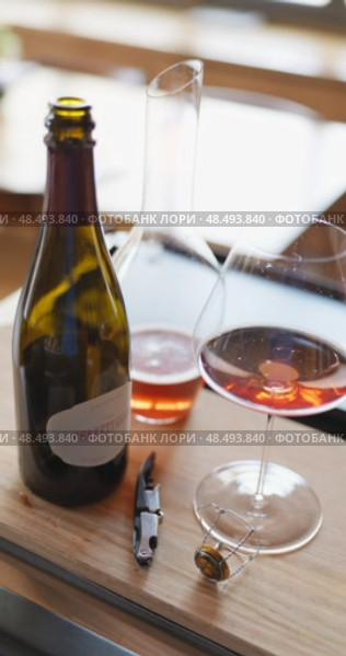 Russia, St.Petersburg, 24 April 2025: bottle of champagne is cooled in a niche with ice in the restaurant, local lighting, wine cabinet, decanters for sparkling wine. Редакционное видео, видеограф Vladimir Drozdin / Фотобанк Лори