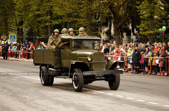 RUSSIAN, KOZELSK, MAY 9, 2017, Victory Day, May 9. Military Parade on anniversary of Victory in Great Patriotic War. Old truck GAZ-AA. Retro military vehicle With Re-Enactors Dressed As Red Army Soldiers. Редакционное фото, фотограф Олег Безруков / Фотобанк Лори