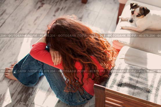 Sad depressed young adult woman crying alone at home, upset. Стоковое фото, фотограф Гладских Татьяна / Фотобанк Лори