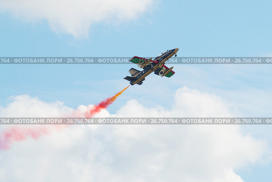 Самолет Aermacchi MB-339 пилотажной группы "Аль Фурсан"  в полете. Фрагмент показательного выступления на авиашоу МАКС-2017. Редакционное фото, фотограф Виктор Карасев / Фотобанк Лори