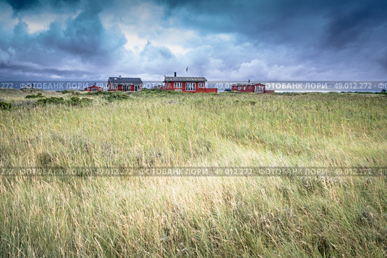Scandinavian summer cabins in stormy weather. Стоковое фото, агентство Ingram Publishing / Фотобанк Лори