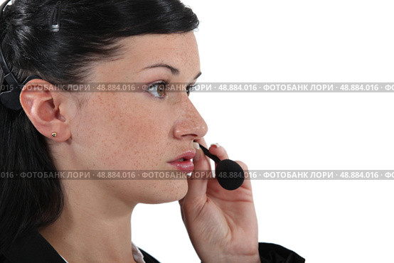 Serious woman with a headset. Стоковое фото, агентство Ingram Publishing / Фотобанк Лори