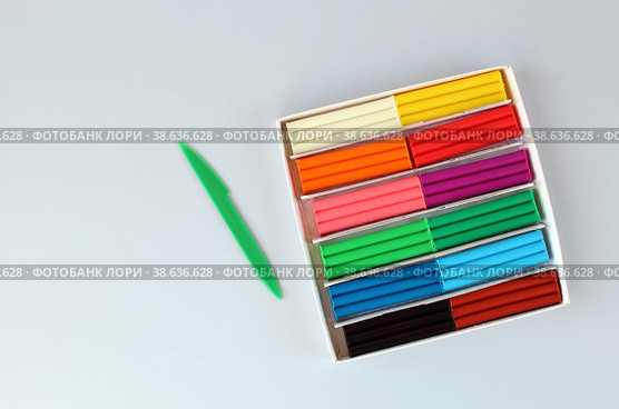 Set of multicolored modeling clay on blue surface. Стоковое фото, фотограф Попова Ольга / Фотобанк Лори