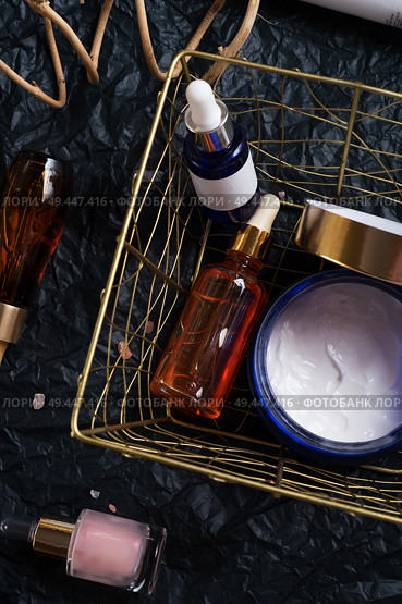 set of nature precious oils and  care cosmetics on black background . Стоковое фото, агентство Ingram Publishing / Фотобанк Лори