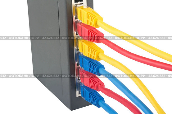 Сетевой коммутатор с подключенными разноцветными сетевыми кабелями. Closeup of network cables connected to router on white. Стоковое фото, фотограф Татьяна Д / Фотобанк Лори