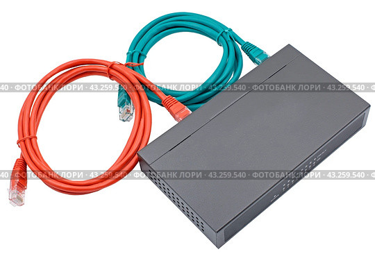 Сетевой коммутатор с подключенными разноцветными сетевыми кабелями. Closeup of network cables connected to router on white. Стоковое фото, фотограф Татьяна Д / Фотобанк Лори