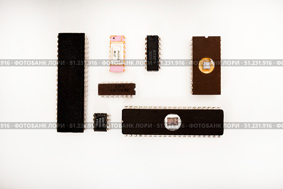 Several different chips on a white background. Old electronic chips. Стоковое фото, фотограф Valeriy Lushchikov / Фотобанк Лори