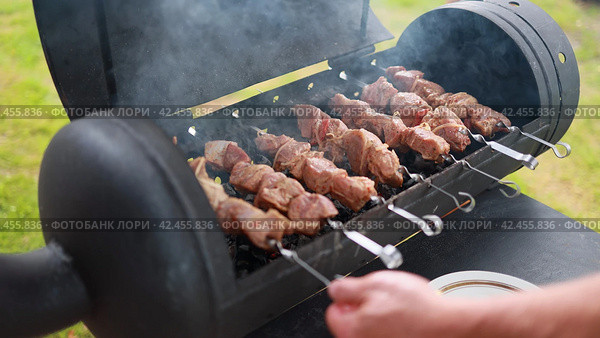 Shashliks are fried on the barbecue. Стоковое фото, фотограф Mikhail Davidovich / Фотобанк Лори