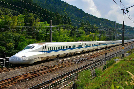 Shinkansen bullet train running through picturesque japanese countryside. Стоковое AI-изображение, AI-художник Иван Рябоконь / Фотобанк Лори