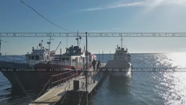 Ships at the pier in Listvyanka, Baikal. Russia. Редакционное видео, видеограф Виктория Кольцова / Фотобанк Лори