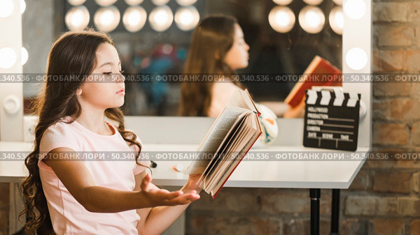 side view girl rehearsing backstage. Стоковое фото, агентство Ingram Publishing / Фотобанк Лори