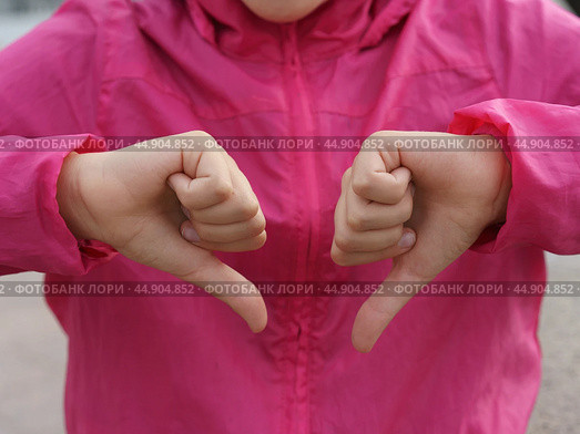 Sign language. Thumb down. Стоковое фото, фотограф YuryKara / Фотобанк Лори