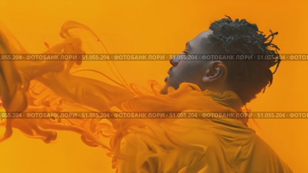 Silhouetted individual surrounded by swirling orange paint creates a dynamic visual effect. Стоковое AI-видео, аниматор Данила Большаков / Фотобанк Лори