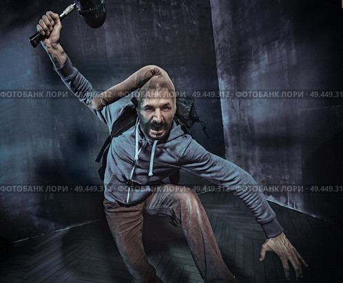 Skinny, geek thief during the robbery. Стоковое фото, агентство Ingram Publishing / Фотобанк Лори