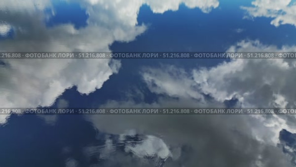 Sky with clouds reflection in water. Стоковое видео, видеограф Михаил Коханчиков / Фотобанк Лори