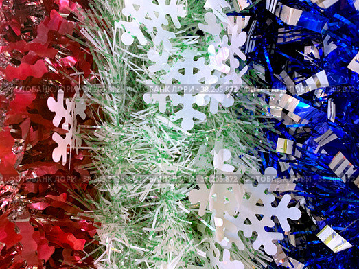 Snowflakes on the background of multi-colored tinsel. Стоковое фото, фотограф Irina Opachevsky / Фотобанк Лори