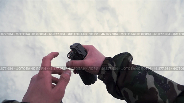 Soldier throws a hand grenade into a battle tank or armored personnel carrier, winter backround, Soldier throws a training grenade into a tank in the winter forest. Стоковая иллюстрация, иллюстратор David Kashakhi / Фотобанк Лори