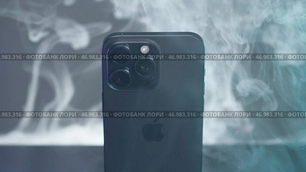 Spectacular promotional video of new iPhone 15 about max on background of smoke (2023 год). Редакционное фото, фотограф David Kashakhi / Фотобанк Лори