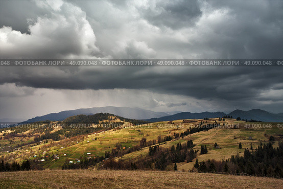 Spring rain in mountains. Thunder and clouds. Стоковое фото, агентство Ingram Publishing / Фотобанк Лори