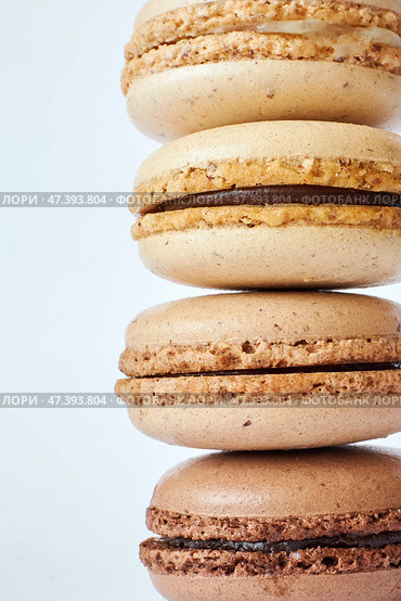 Stack of four brown French Macarons, cakes with coffee and creme brulee flavor. Стоковое фото, фотограф Екатерина Якименко / Фотобанк Лори