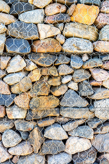 Stone wall with metal grid as background. Стоковое фото, фотограф FotograFF / Фотобанк Лори