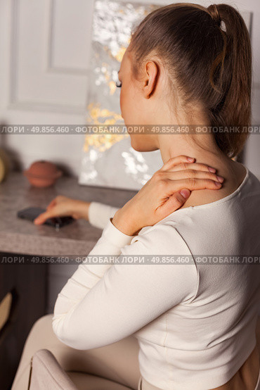 Struggles of a Lonely Woman Grappling With Emotions in a Quiet Indoor Space at Dusk. Стоковое фото, фотограф Aleksandr Golubev / Фотобанк Лори