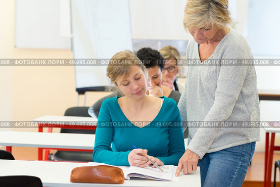 student and teacjer learning together. Стоковое фото, агентство Ingram Publishing / Фотобанк Лори