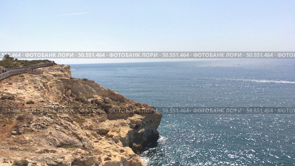 Summer Atlantic ocean rocky coastline near Carvoeiro town, Lagoa, Algarve - Portugal. Стоковое фото, агентство Ingram Publishing / Фотобанк Лори