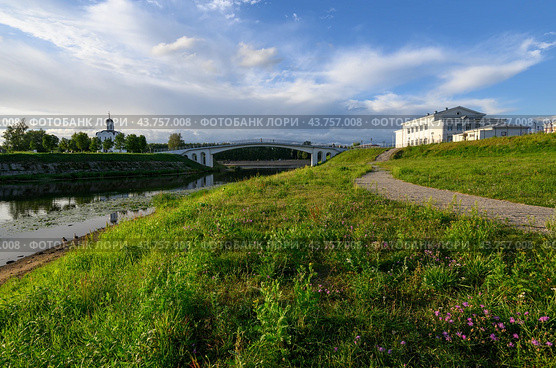Summer city Tver landscape concept of Church of St. Michael, Grand Prince of Tver on river Volga surface, green grass embankment, bridge and cloudy sky, trees and builduing. Tver, Tourism in Russia. Стоковое фото, фотограф Евгений / Фотобанк Лори
