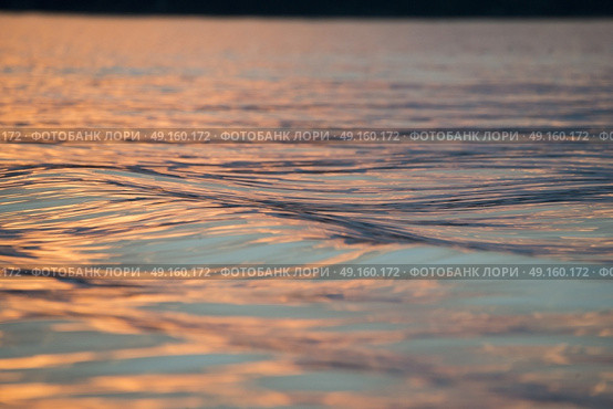 Surface of the water on the Lake at dusk, Lake of The Woods, Ontario, Canada. Стоковое фото, агентство Ingram Publishing / Фотобанк Лори