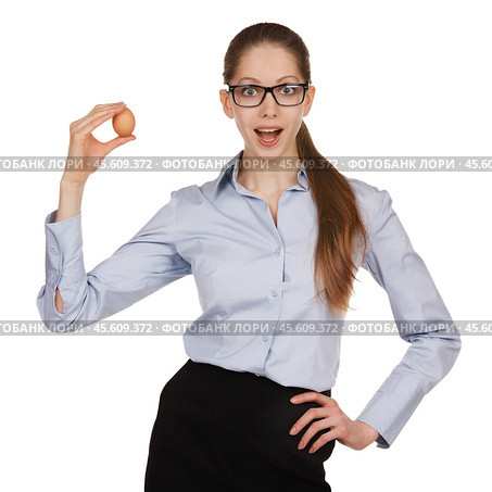 Surprised girl with chicken egg on a white background. Стоковое фото, фотограф Дмитрий Киселёв / Фотобанк Лори
