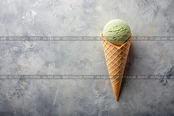 Sweet dessert. Ice cream cones with different flavors on a concrete gray background. World Ice Cream Day. Стоковое AI-изображение, AI-художник Photojuli / Фотобанк Лори