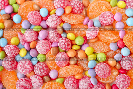 Sweet multicolor candies spreading  on background. Стоковое фото, агентство Ingram Publishing / Фотобанк Лори