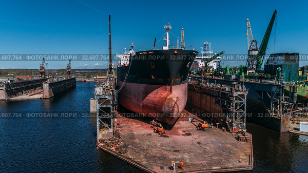 Tanker vessel repair in dry dock Shipyard, Drone shot. Стоковое фото, фотограф Aleksejs Bergmanis / Фотобанк Лори