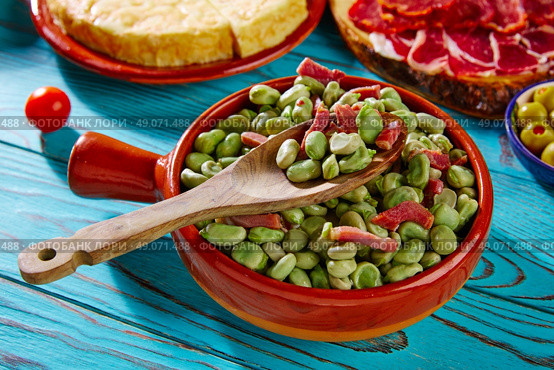 Tapas lima beans with iberico ham from Spain on wood. Стоковое фото, агентство Ingram Publishing / Фотобанк Лори