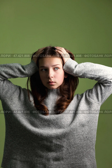 Teen Girl Expresses Deep Emotions in a Creative Studio Setting With Copy-Space for Text. Стоковое фото, фотограф Aleksandr Golubev / Фотобанк Лори