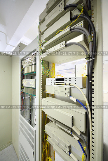 Telecom equipment with cables and switches in communication center. Стоковое фото, фотограф Losevsky Pavel / Фотобанк Лори