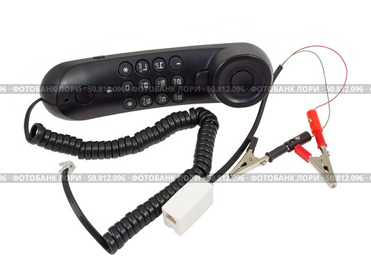 Телефонная трубка с зажимами на белом фоне. Telephone handset with clips on white background. Стоковое фото, фотограф Татьяна Д / Фотобанк Лори