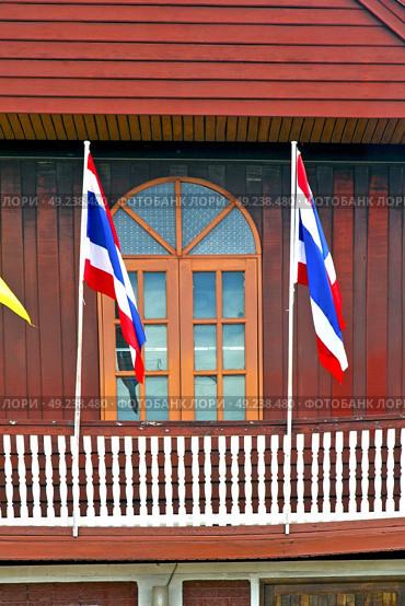 temple   in  bangkok thailand incision red venetian blind and terrace waving flag . Стоковое фото, агентство Ingram Publishing / Фотобанк Лори