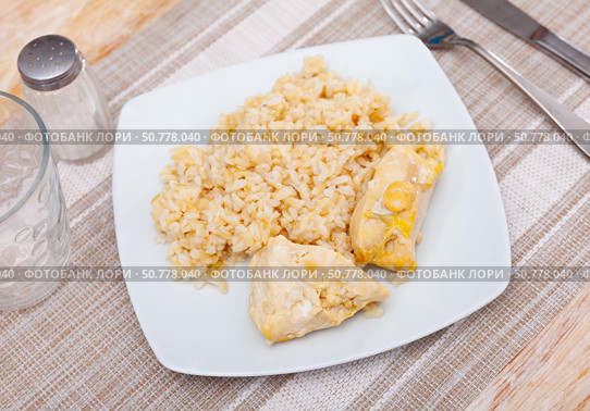 Tender meat of baked chicken breast is garnished with boiled basmati rice. Стоковое фото, фотограф Яков Филимонов / Фотобанк Лори