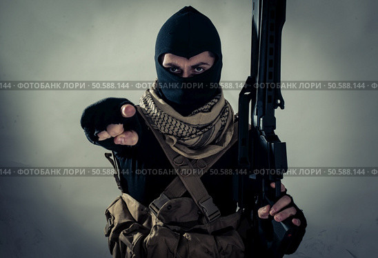 Terrorist menacing western countries on a tape. Concept about terrorism and hybrid warfare. Стоковое фото, агентство Ingram Publishing / Фотобанк Лори