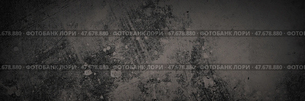 Texture of old concrete wall. Rough dark gray concrete surface with spots, cracks, noise and grain. Dark wide panoramic background for grunge style design. Shaded vintage texture with vignette. Стоковое фото, фотограф Андрей Степанов / Фотобанк Лори